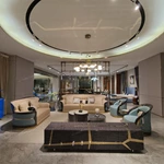 Cream Curved Sofa with Diamond-Quilted Backrest, Dark High-Gloss Sides and Teal Accent Panels